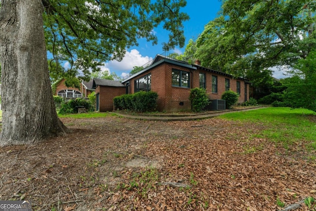 3105 Woodlawn Ave, Columbus, GA 31904 - view of property exterior featuring brick siding, crawl space, and a chimney