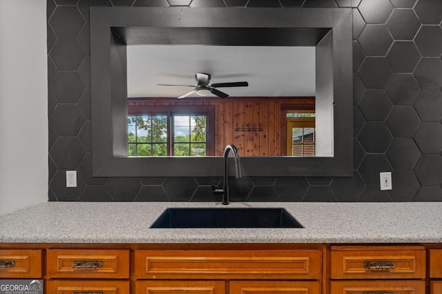3105 Woodlawn Ave, Columbus, GA 31904 - kitchen with brown cabinets, ceiling fan, tasteful backsplash, and light countertops