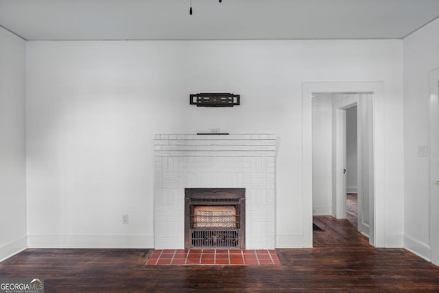 3105 Woodlawn Ave, Columbus, GA 31904 - unfurnished living room with wood finished floors and a brick fireplace