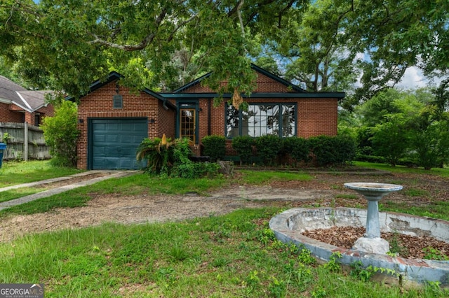 3105 Woodlawn Ave, Columbus, GA 31904 - view of front of property featuring an attached garage, driveway, and brick siding