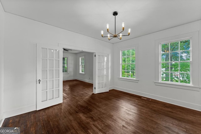 3105 Woodlawn Ave, Columbus, GA 31904 - unfurnished dining area featuring a chandelier, healthy amount of natural light, wood finished floors, and french doors