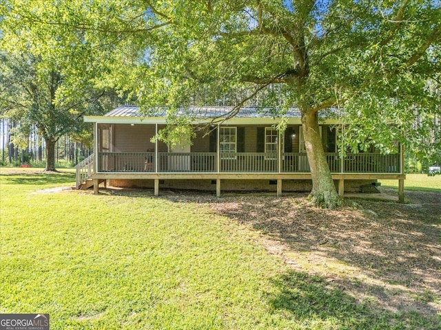 446 Thornton Rd, Washington, GA 30673 - back of property with a lawn, covered porch, and a metal roof