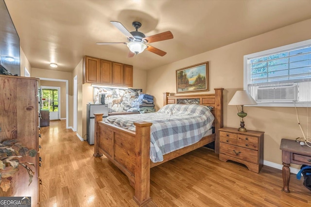 446 Thornton Rd, Washington, GA 30673 - bedroom featuring light wood-style flooring, cooling unit, and a ceiling fan