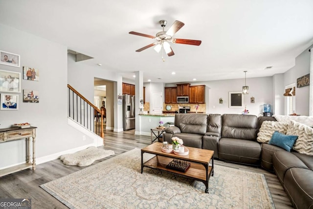 2755 Evan Manor Ln, Cumming, GA 30041 - living room with wood finished floors, ceiling fan, stairway, and recessed lighting