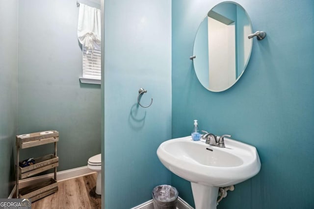 2755 Evan Manor Ln, Cumming, GA 30041 - bathroom with wood finished floors and toilet
