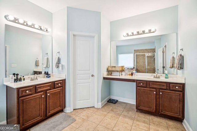 2755 Evan Manor Ln, Cumming, GA 30041 - full bathroom with a shower stall, two vanities, and tile patterned floors