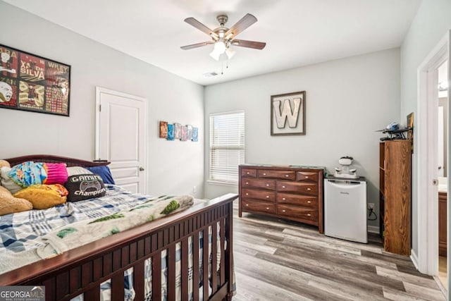 2755 Evan Manor Ln, Cumming, GA 30041 - bedroom with fridge, wood finished floors, and ceiling fan