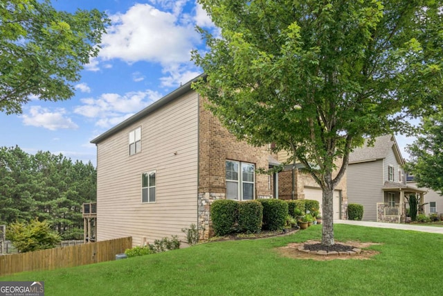 2755 Evan Manor Ln, Cumming, GA 30041 - view of property exterior with concrete driveway, a garage, and brick siding