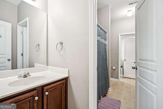 2755 Evan Manor Ln, Cumming, GA 30041 - full bath with vanity and tile patterned flooring