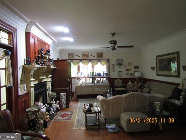 5523 Bahia Mar Cir, Stone Mountain, GA 30087 - living area with crown molding, a ceiling fan, wood finished floors, and a fireplace