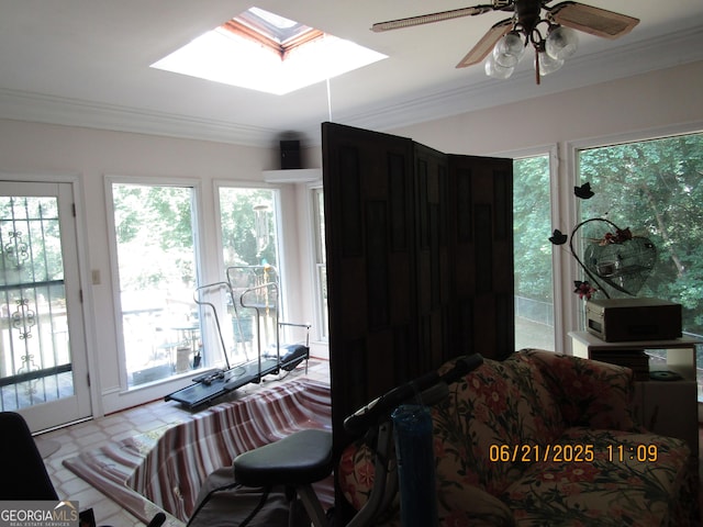 5523 Bahia Mar Cir, Stone Mountain, GA 30087 - living room featuring crown molding, a skylight, and a ceiling fan