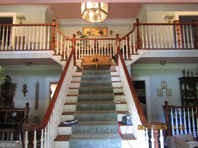 5523 Bahia Mar Cir, Stone Mountain, GA 30087 - staircase featuring a chandelier and crown molding