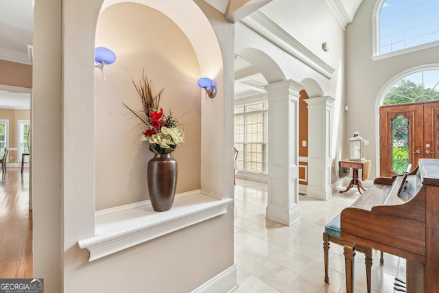 106 April Walk, Mcdonough, GA 30253 - foyer entrance featuring decorative columns, arched walkways, and ornamental molding