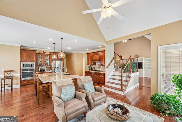 106 April Walk, Mcdonough, GA 30253 - living area with wood finished floors, stairway, recessed lighting, ornamental molding, and a ceiling fan
