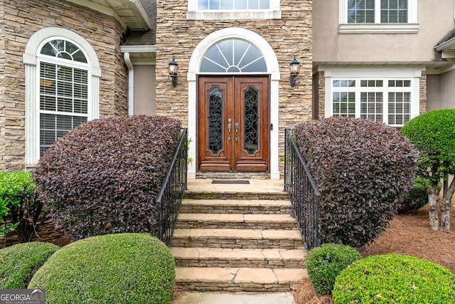 106 April Walk, Mcdonough, GA 30253 - doorway to property with stone siding, french doors, and stucco siding