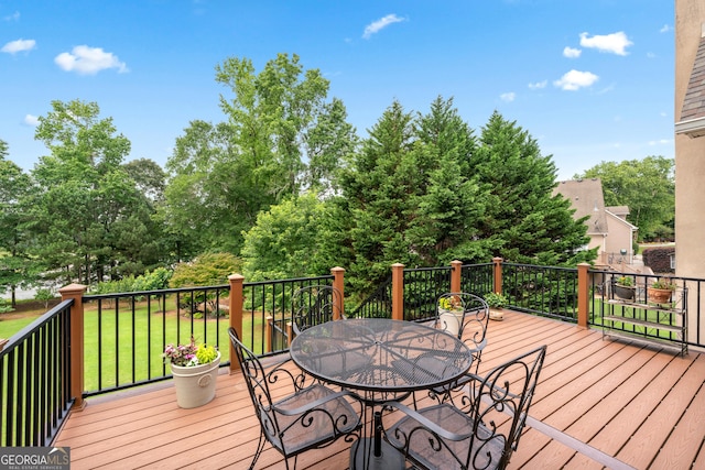 106 April Walk, Mcdonough, GA 30253 - wooden deck featuring outdoor dining area, a yard, and view of scattered trees