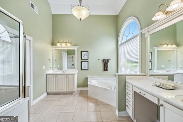 106 April Walk, Mcdonough, GA 30253 - full bathroom featuring a bath, tile patterned flooring, a shower stall, a towering ceiling, and two vanities