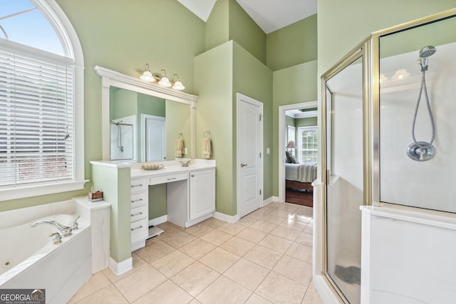 106 April Walk, Mcdonough, GA 30253 - ensuite bathroom featuring a stall shower, vanity, tile patterned flooring, and a whirlpool tub