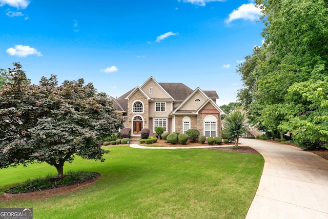 106 April Walk, Mcdonough, GA 30253 - traditional home featuring a front lawn, concrete driveway, and brick siding