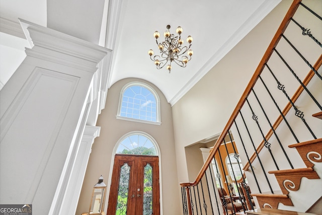 106 April Walk, Mcdonough, GA 30253 - foyer entrance featuring a towering ceiling, stairway, and a chandelier