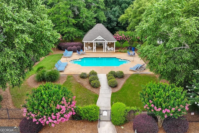 106 April Walk, Mcdonough, GA 30253 - view of pool featuring a storage structure, an outbuilding, and a patio area