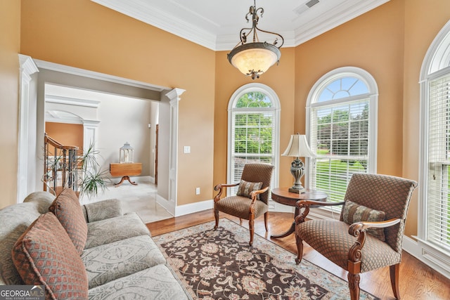 106 April Walk, Mcdonough, GA 30253 - sitting room featuring decorative columns, ornamental molding, and light wood finished floors