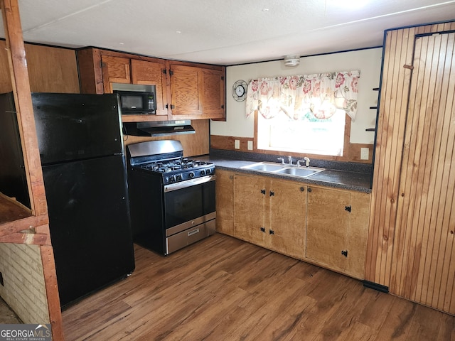 2340 Ridgeway Dr, Gainesville, GA 30504 - kitchen with black appliances, dark wood-type flooring, dark countertops, and under cabinet range hood