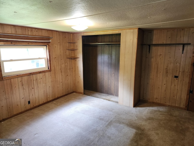 2340 Ridgeway Dr, Gainesville, GA 30504 - unfurnished bedroom featuring carpet and wood walls