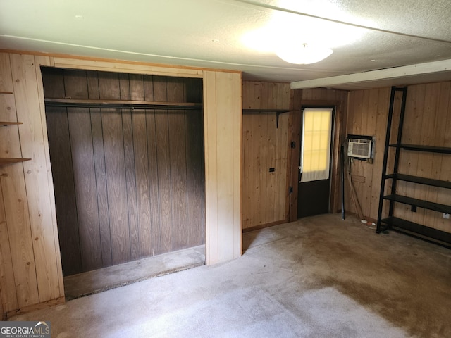 2340 Ridgeway Dr, Gainesville, GA 30504 - unfurnished bedroom featuring wooden walls, a wall mounted AC, and carpet flooring