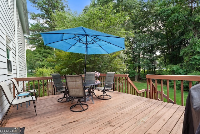 150 Tramore Trce, Tyrone, GA 30290 - wooden deck featuring outdoor dining area and view of scattered trees
