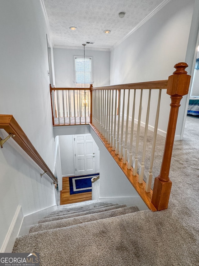 150 Tramore Trce, Tyrone, GA 30290 - stairs with ornamental molding, carpet, a textured ceiling, and recessed lighting