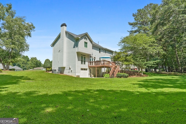 150 Tramore Trce, Tyrone, GA 30290 - rear view of house with a deck, stairs, a chimney, and a yard