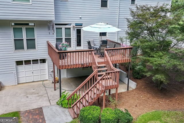 150 Tramore Trce, Tyrone, GA 30290 - deck with an attached garage, driveway, and stairs