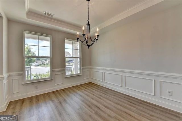 6867 Kate, Flowery Branch, GA 30542 - unfurnished room featuring a chandelier, light wood-type flooring, a wainscoted wall, ornamental molding, and a decorative wall