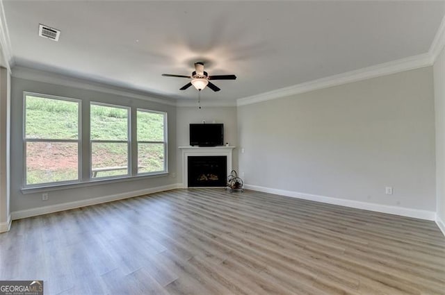 6867 Kate, Flowery Branch, GA 30542 - unfurnished living room with ceiling fan, crown molding, light wood finished floors, and a fireplace