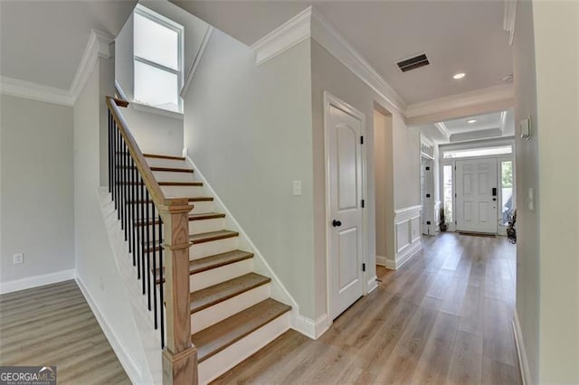 6867 Kate, Flowery Branch, GA 30542 - foyer entrance with crown molding, stairs, light wood-style flooring, and recessed lighting