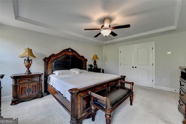 6867 Kate, Flowery Branch, GA 30542 - bedroom with a raised ceiling, light carpet, a ceiling fan, a closet, and ornamental molding