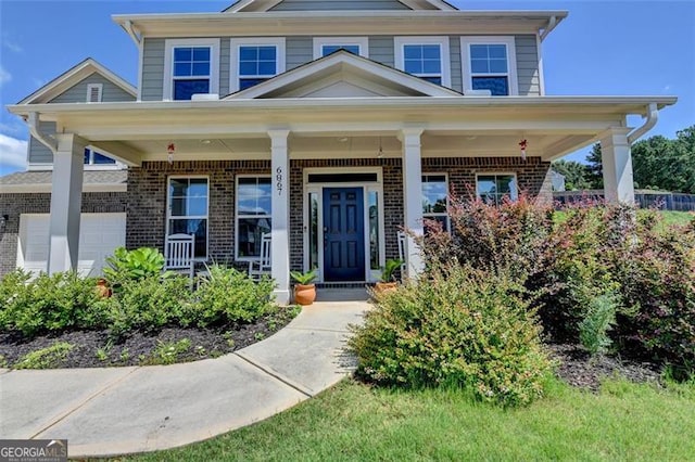 6867 Kate, Flowery Branch, GA 30542 - view of front of house featuring brick siding and covered porch