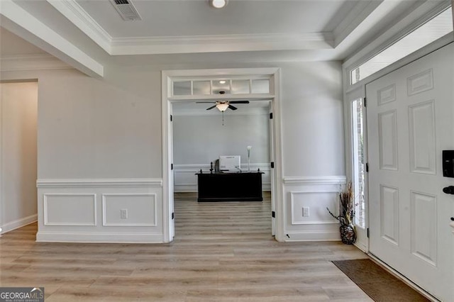 6867 Kate, Flowery Branch, GA 30542 - entryway featuring light wood-style flooring, a decorative wall, crown molding, ceiling fan, and wainscoting