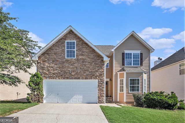 915 Pebble Creek Trl, Suwanee, GA 30024 - traditional home featuring driveway, stone siding, and an attached garage