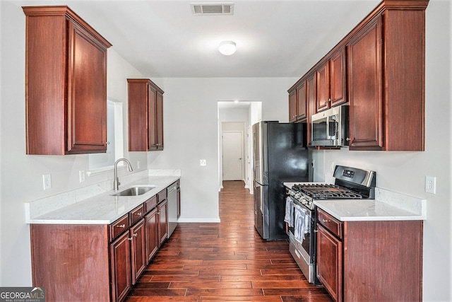 915 Pebble Creek Trl, Suwanee, GA 30024 - kitchen featuring appliances with stainless steel finishes and dark wood-style floors