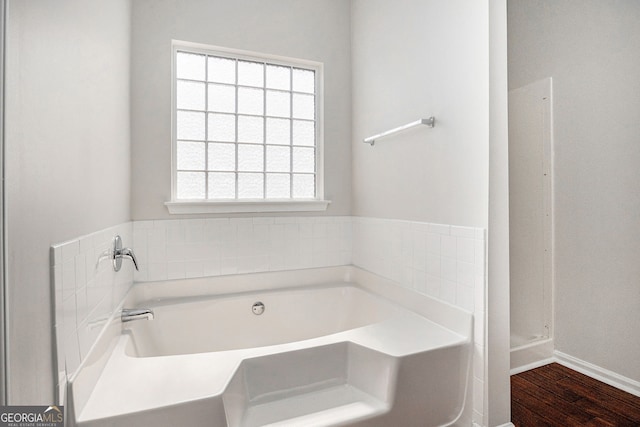 915 Pebble Creek Trl, Suwanee, GA 30024 - full bath featuring a garden tub and wood finished floors