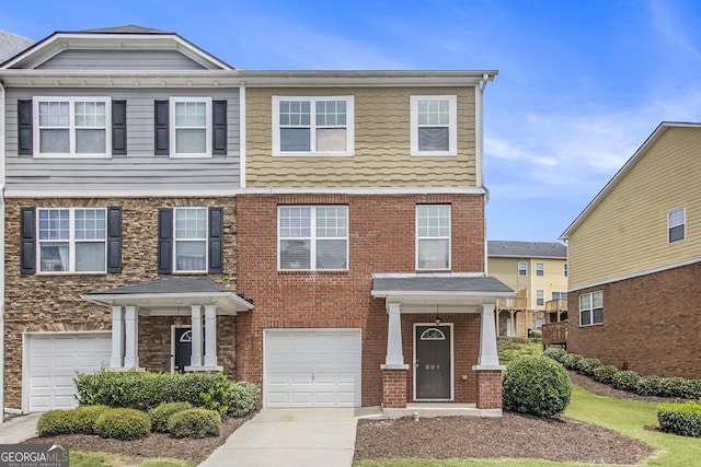 801 Tulip Poplar Way Unit 2501, Lawrenceville, GA 30044 - view of front facade with an attached garage and driveway
