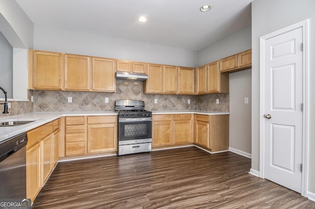 801 Tulip Poplar Way Unit 2501, Lawrenceville, GA 30044 - kitchen with stainless steel appliances, under cabinet range hood, light countertops, dark wood-type flooring, and decorative backsplash