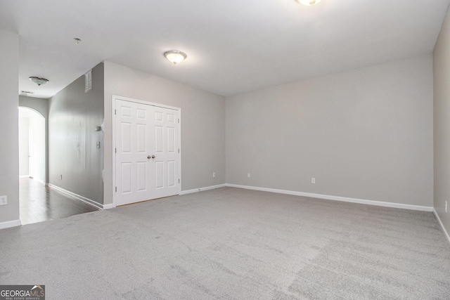 801 Tulip Poplar Way Unit 2501, Lawrenceville, GA 30044 - unfurnished bedroom with carpet floors, arched walkways, and a closet