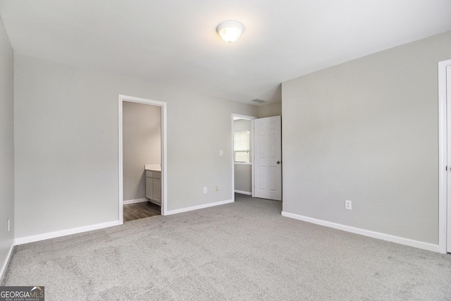 801 Tulip Poplar Way Unit 2501, Lawrenceville, GA 30044 - unfurnished bedroom featuring carpet floors and connected bathroom