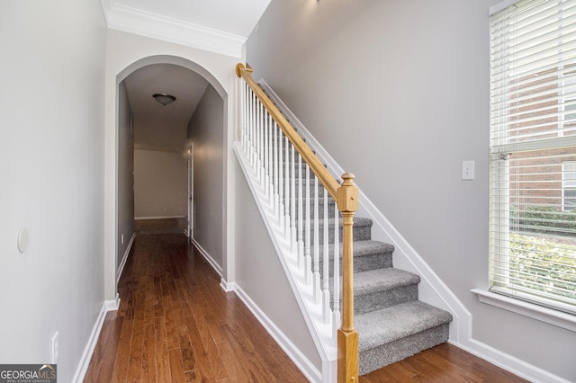 801 Tulip Poplar Way Unit 2501, Lawrenceville, GA 30044 - staircase featuring arched walkways, wood finished floors, and ornamental molding