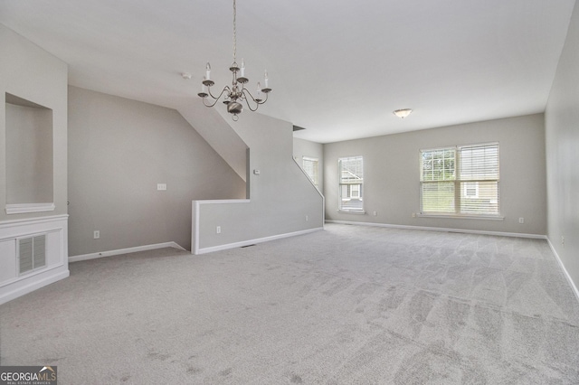 801 Tulip Poplar Way Unit 2501, Lawrenceville, GA 30044 - unfurnished living room featuring a chandelier, carpet flooring, and vaulted ceiling