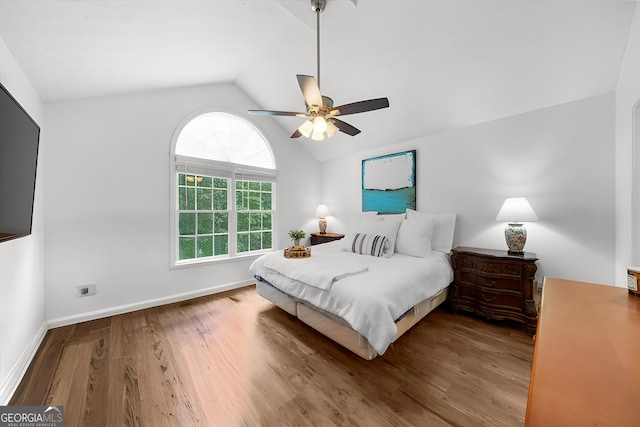 205 River Flow Dr, Dahlonega, GA 30533 - bedroom with vaulted ceiling, wood finished floors, and ceiling fan