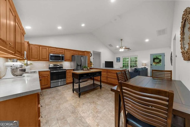 205 River Flow Dr, Dahlonega, GA 30533 - kitchen with appliances with stainless steel finishes, a ceiling fan, recessed lighting, brown cabinets, and light countertops